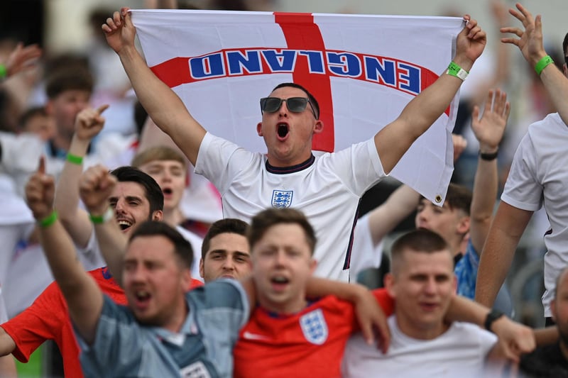 Supporters sing the national anthem at the 4TheFans Fan Park in Manchester ahead of the start of the football match between England and Germany being played in London (AFP via Getty Images)