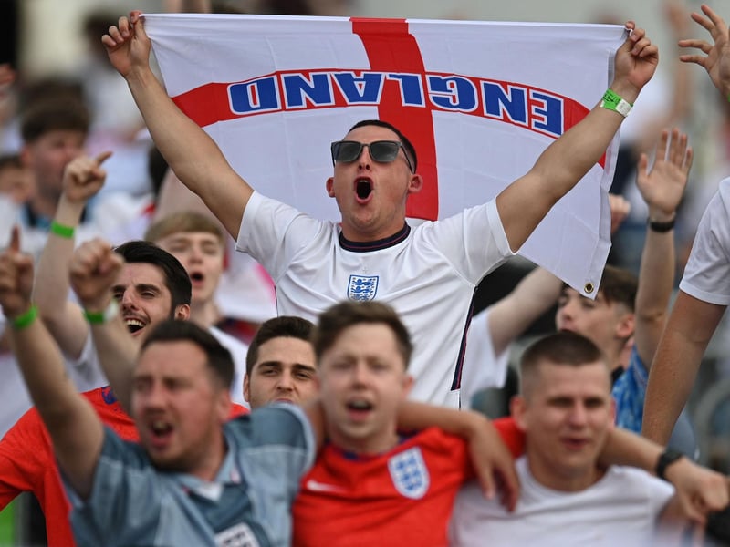 Supporters sing the national anthem at the 4TheFans Fan Park in Manchester ahead of the start of the football match between England and Germany being played in London (AFP via Getty Images)