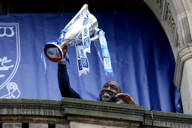 Sheffield Wednesday manager Darren Moore lifts the trophy on the balcony of Sheffield Town Hall as he celebrates their promotion following an open top bus parade. Photo: Richard Sellers/PA Wire.