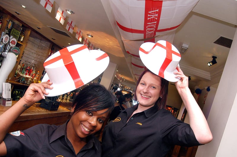 Staff members Denise Depass and Jenny Shaw pictured in the decorated pub ready for England's opening game of the 2010 World Cup.