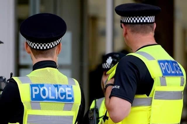 King Edward VII School told parents police were investigating after reports of men trying to lure children into vans in the High Storrs area of Sheffield. File photo of police officers