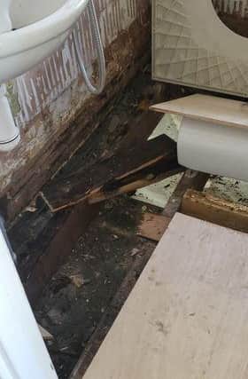 Floorboards were ripped up in their bathroom before being temporarily covered as the repair team didn't have the materials for the job.