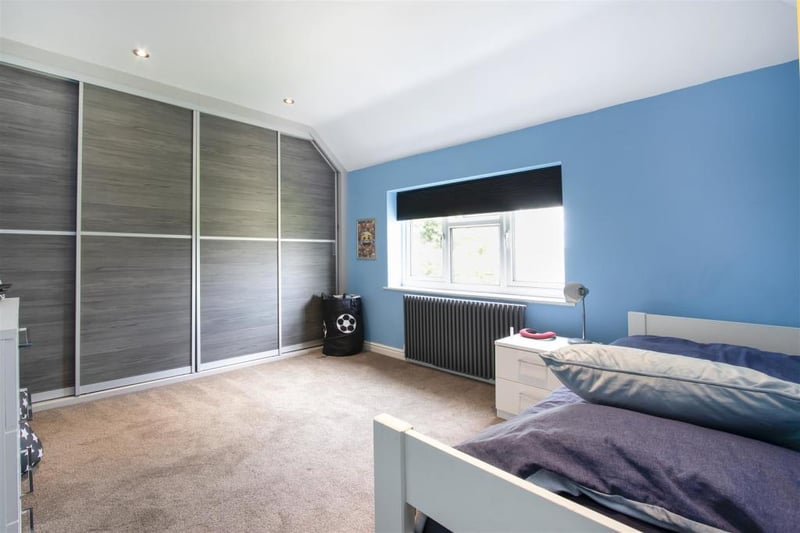 Bedroom three is one of three first-floor bedrooms with fitted wardrobes.