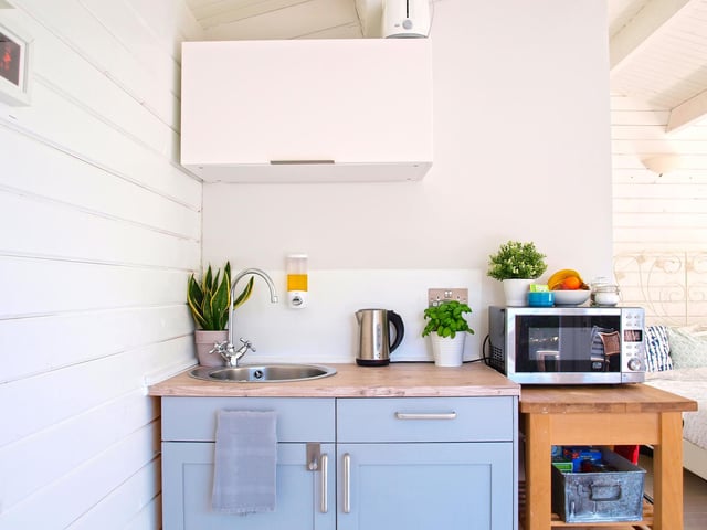 The cosy kitchen amenities inside Sea Mist's additional cabin.