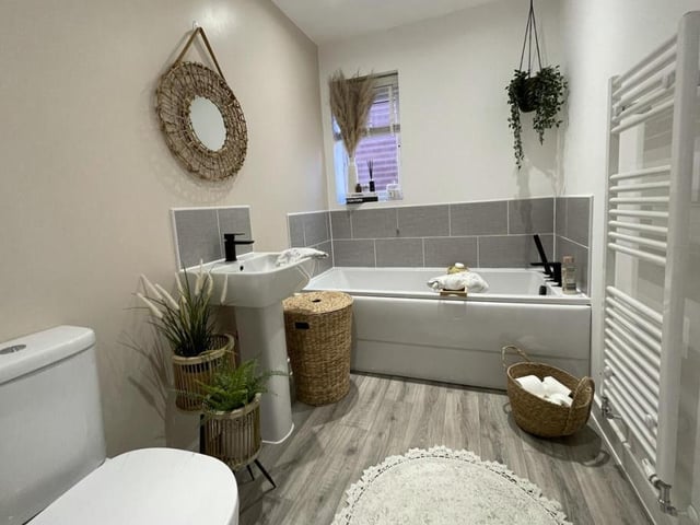 We don't have a picture of the third bedroom, but here is the splendid family bathroom. It includes a panelled bath, pedestal sink with mixer tap, a mixer tallow flush WC and a heated towel-rail. A frosted glass window faces the side of the property.