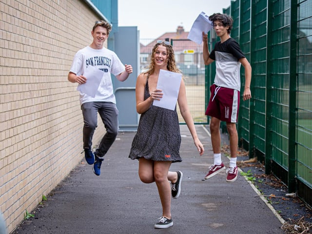 Alex Bird and Kate Cooper, Melic Oughton jump for joy after collecting results at UTC College in Portsmouth. Picture: Habibur Rahman