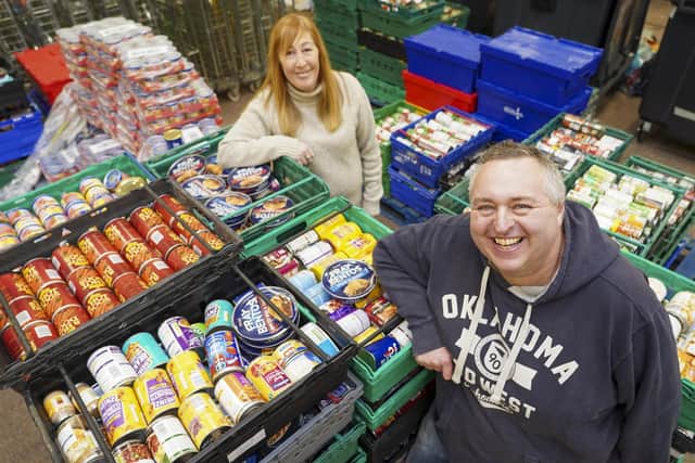 Manager Chris Hardy and volunteer Kerry O'Connell with some of the food donated by Sheffield Telegraph readers at the S6 Food Bank. Picture Scott Merrylees