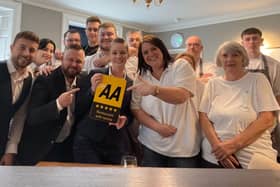 The hotel team celebrate the five star rating