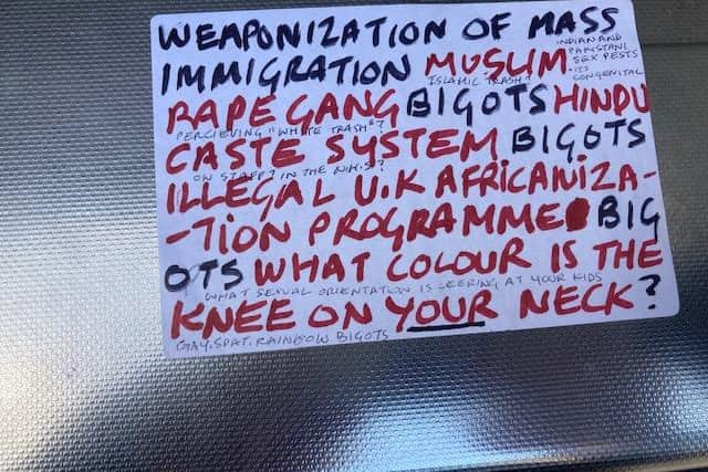 The bigoted stickers were posted on ATMs and lampposts across the city.