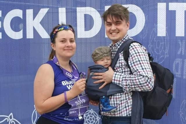 Jess Brown after completing the Sheffield Half Marathon in aid of Bluebell Wood Children's Hospital, with her husband Daniel and baby Rupert, who was born just 10 weeks earlier