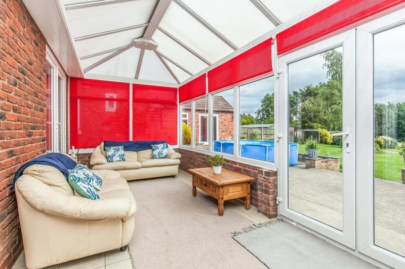 Cosy and comfortable are the words that spring to mind when stepping into the conservatory. Made of brick and upvc, it has a ceramic tiled floor, while double-glazed French windows lead into the back garden.