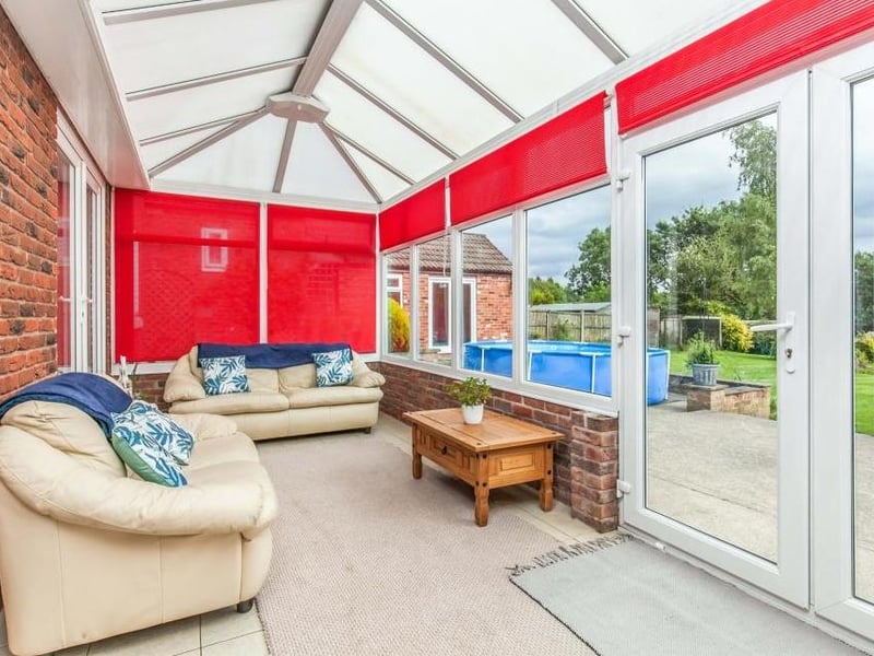 Cosy and comfortable are the words that spring to mind when stepping into the conservatory. Made of brick and upvc, it has a ceramic tiled floor, while double-glazed French windows lead into the back garden.