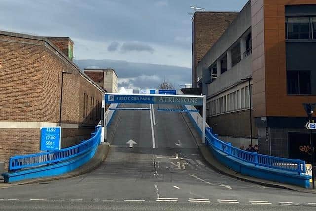 The concrete ramp up to Atkinson's car park covers much of Holy Green
