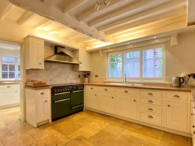 The breakfast kitchen has been fitted with farmhouse-style units and wood-effect work surfaces. Other highlights include a Rangemaster multi-fuel range cooker with extractor canopy over, integrated dishwasher, tiled floor, ceiling spotlights, window shutters to the front and beamed ceiling.