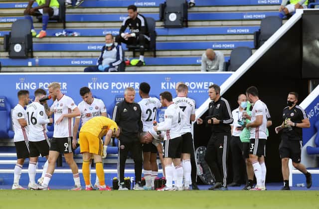 Sheffield United's manager Chris Wilder, centre, gives instructions to his players during the English Premier League soccer match between Leicester City and Sheffield United at the King Power Stadium, in Leicester, England, Thursday, July 16, 2020. (Cath Ivill/Pool via AP)