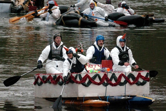 Splashing about on the river as the annual boxing day raft race starts in Matlock and goes down the River Derwent to Cromford after passing through Matlock Bath in 2003