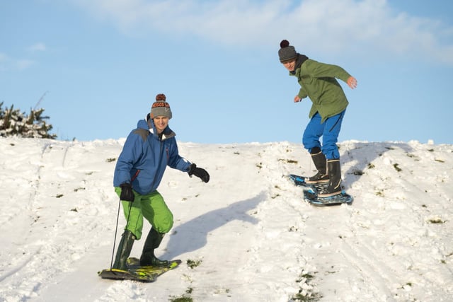 Brothers Gordon and Alex Aitken turn their sledges into snowboards at The Braids