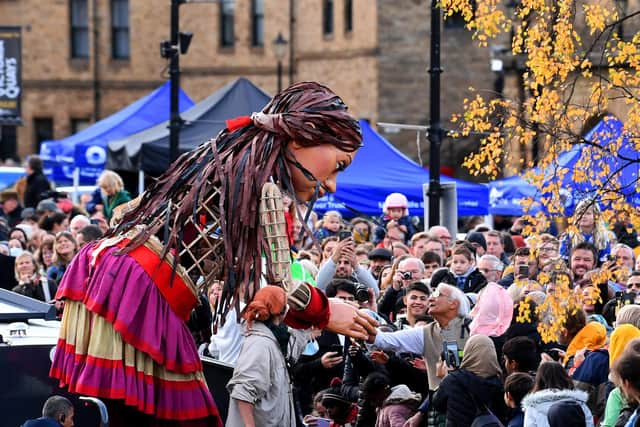Little Amal meets the the public at Victoria Quays, Sheffield..29th October 2021..