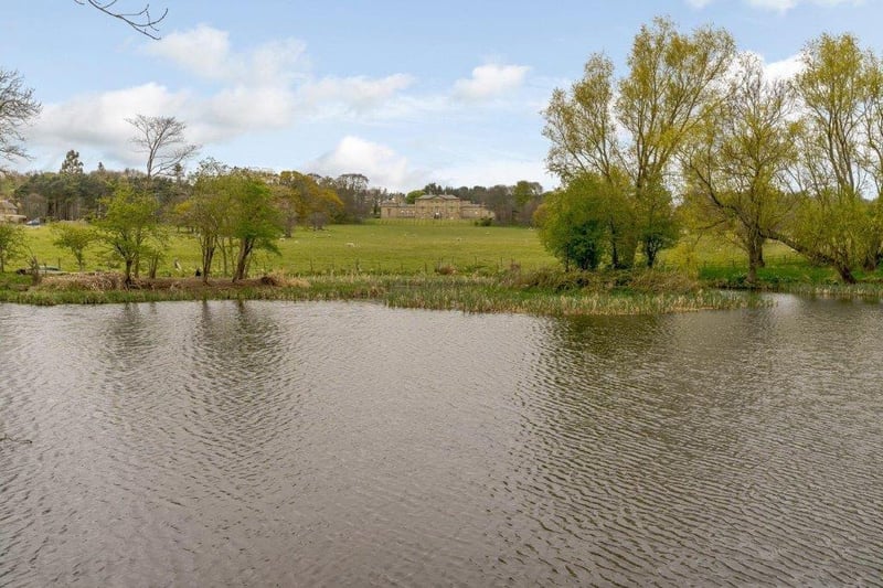 The hall sits amongst 24acres of parkland including a small lake.