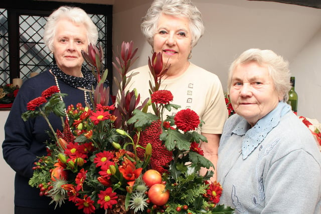 Chesterfield Flower Lovers Gwen Hallam, Trixie Short chairman and Anne Queen decorated Revolution House in 2008