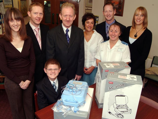 The Bostrom family presened four nebulisers purchased through the Shires Pharmacy at Shirebrook to Ward 2 at Kings Mill Hospital in 2006 in memory of Moira Bostrom. Moiras husband Ray, centre, made the presentation supported by his family to ward staff. Pictured from the left are; Louise Yarnell, sons Peter and Martin Bostrom, Ray Bostrom, Deputy Ward Leader Helen Barker, son Paul Bostrom, Staff Nurse Mary Box and Clare Edis.
