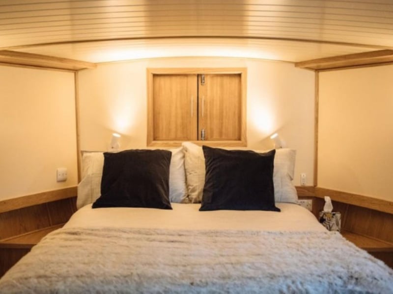 The master bedroom has a comfortable kingsize bed.