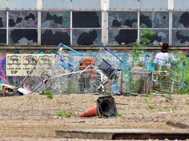 Filming in Sheffield for new HBO miniseries The Regime, starring Kate Winslet and Hugh Grant. Posters are plastered onto a wall as a dystopian landscape is created at a disused site in Shalesmoor. Photos by @steelcitysnaps via Twitter
