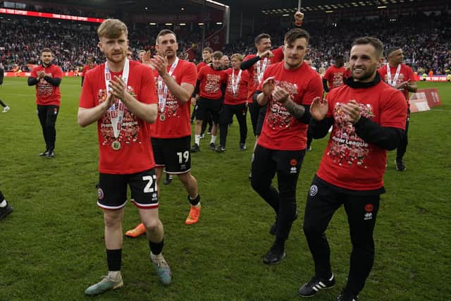 Tommy Doyle of Sheffield United celebrates promotion: Andrew Yates / Sportimage