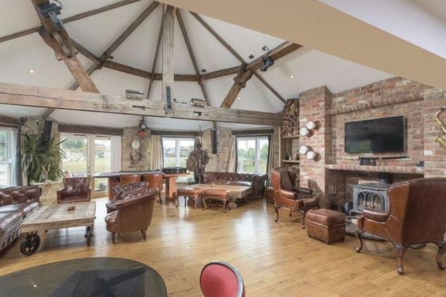 The house has wood and travertine stone floors throughout, with under floor heating for staying warm.