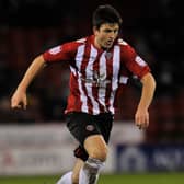 Harry Maguire in action for Sheffield United against Rochdale