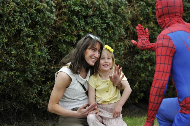 Spider Man swings in for a guest appearance at the opening of the new California Community Hub
