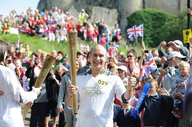 Olympic Torch bearer Tony Eaton arrives in Castle Hill, Conisbrough .