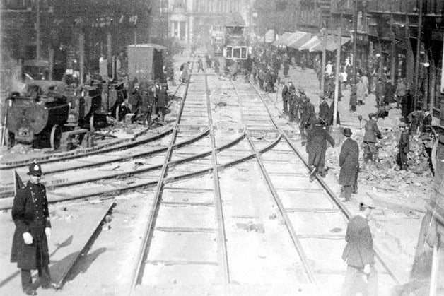 Laying of tram tracks on Fargate looking towards the Star and Telegraph Offices, High Street, note tar boilers, left. Date Period: 1900-1919. Pic: www.picturesheffield.com Ref: v00896