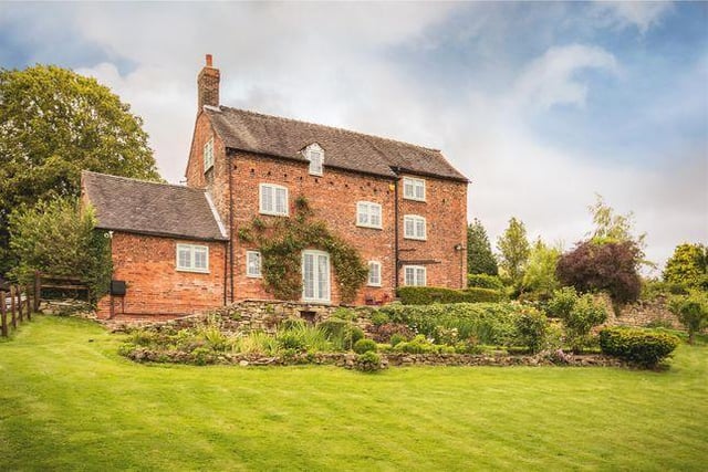 This "sympathetically upgraded" five double bedroom farm house has a wealth of character and charm throughout, including wood paneling, feature fireplaces and a bare brick bread oven with cast iron door. Marketed by Fletcher & Company, 01332 494134.