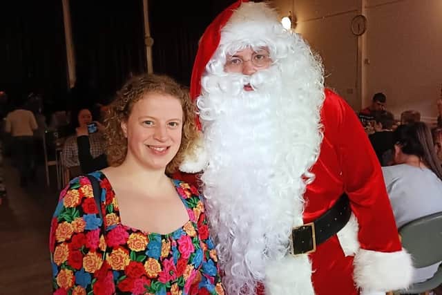 Olivia Blake, MP for Sheffield Hallam, with Santa at the Stannington Christmas party