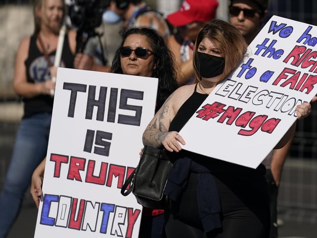 Supporters of President Donald Trump rally outside the Maricopa County Recorder's Office (AP Photo/Ross D. Franklin)