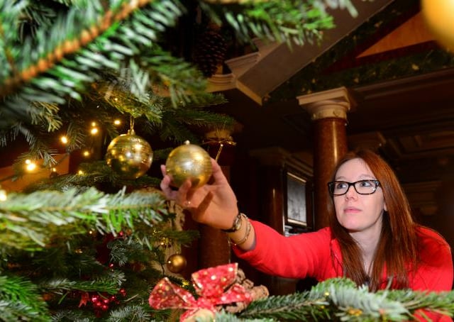 Bethany Ronksley decorating a tree inside Brodsworth Hall, 2015.