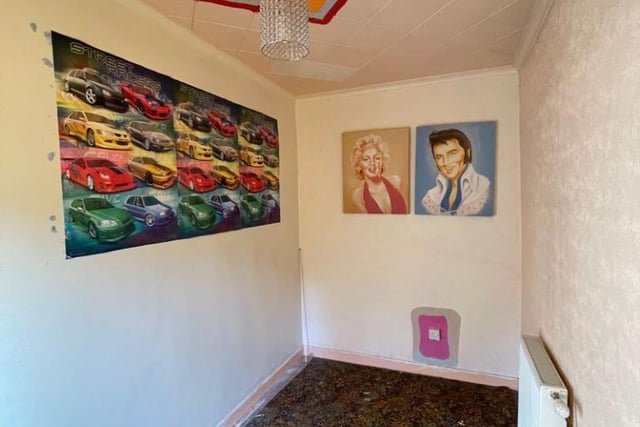 One of the bedrooms, which has murals of Elvis Presley and Marylin Monroe.