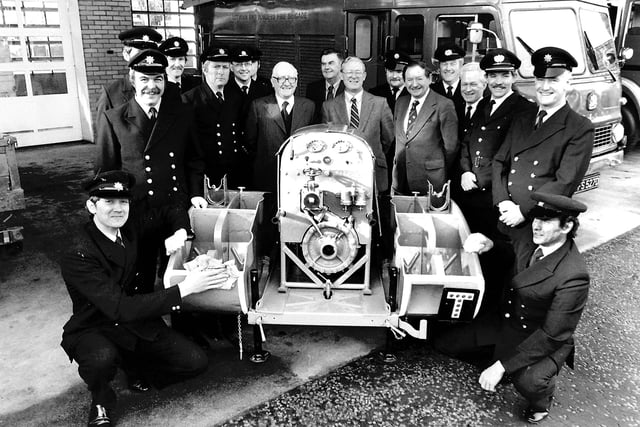 Gala firemen present a restored pump, February 1982.