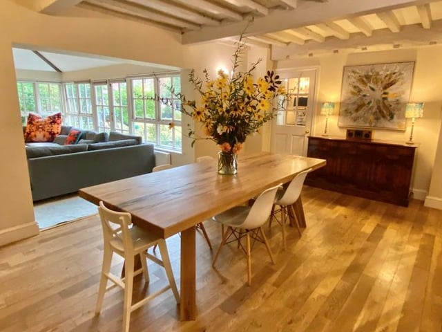 Another view of the dining room, which has a lovely ambience to it. In the background is the family room or garden room.