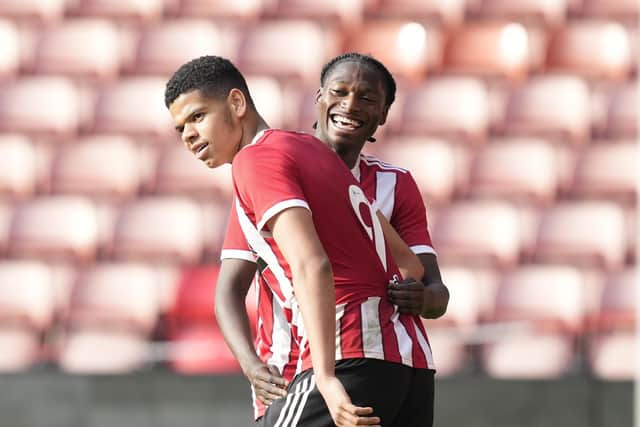 Will Osula of Sheffield United (L) celebrates a goal for the club's development squad: Andrew Yates / Sportimage