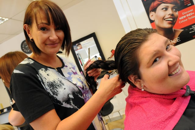 Shannon Boyd has her cut in aid of the Little Princess Trust in 2014, with KT hairdressers owner Katie Cook looking on. Remember this?