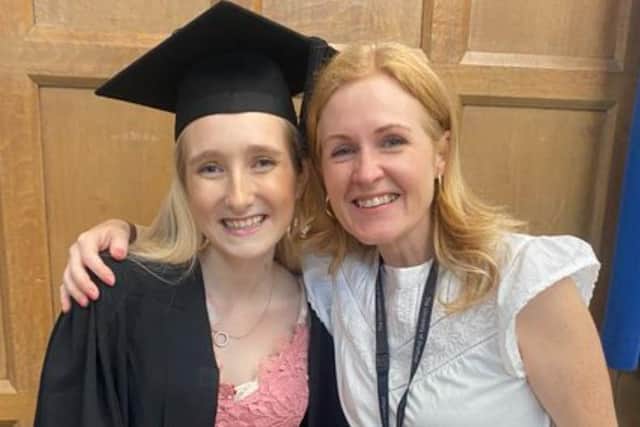 Inspirational 25-year-old Katie Bennett-Hogg has plenty to smile about – as she has just graduated with a diploma that she fought through pain to obtain, just six weeks after having an operation she hopes will transform her life. Katie, is pictured left, with one of her teachers. Picture: Kate Bennett-Hogg