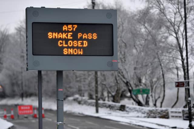 DERBYSHIRE,  - JANUARY 30: A sign showing the A57 Snake Pass closed after snow feel overnight in Glossop, part of the High Peak district on January 30, 2019 in Derbyshire, United Kingdom. Travellers face delays as snow and icy conditions have hit parts of the United Kingdom. (Photo by Anthony Devlin/Getty Images)
