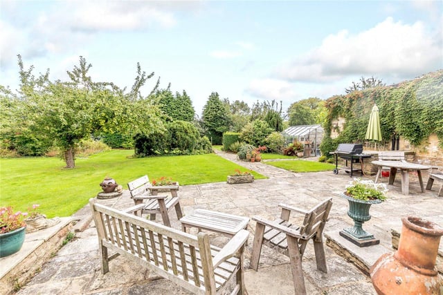 The huge gardens include an attractive stone terrace area, which is south facing and provides an ideal space for al fresco dining.
