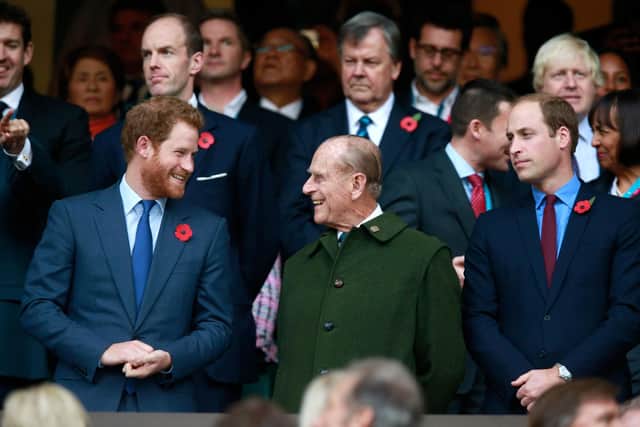 Prince Harry, Prince Phillip and Prince William enjoy the atmosphere during the 2015 Rugby World Cup Final match between New Zealand and Australia at Twickenham Stadium (Photo by Phil Walter/Getty Images)