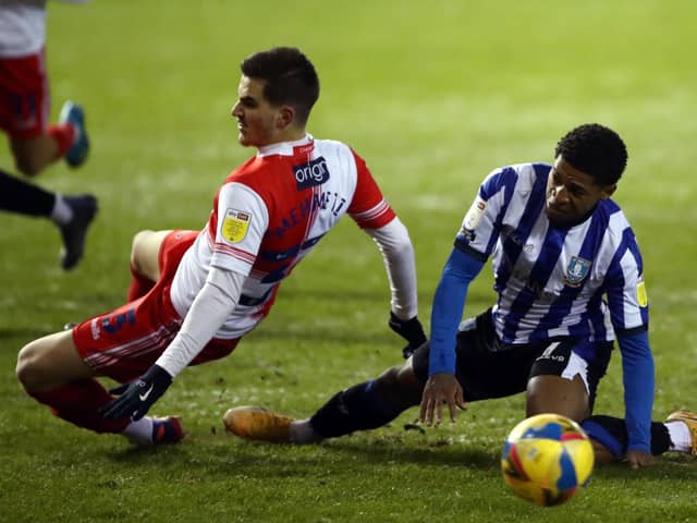 Kadeem Harris with a challenge in the Sheffield Wednesday box. (Tim Goode/PA Wire)