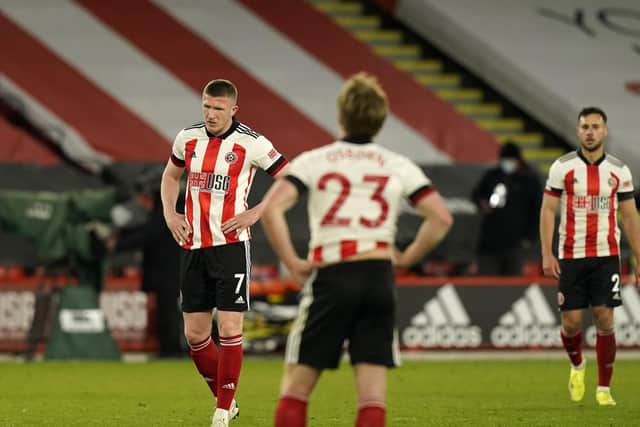 John Lundstram (L) is also expected to leave Sheffield United: Andrew Yates / Sportimage