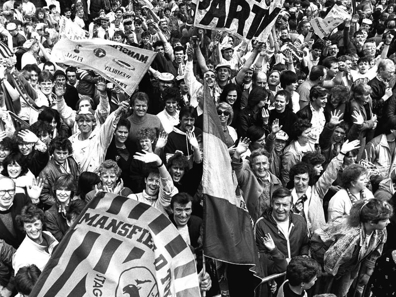 Fans celebrate after Mansfield's dramatic win at Wembley - can you spot anyone you know in the crowd?