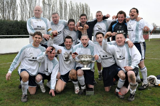 NBC Dragons celebrate their victory in the Father Purcell Cup at Cams Alders, 2006. Picture: Mick Young
